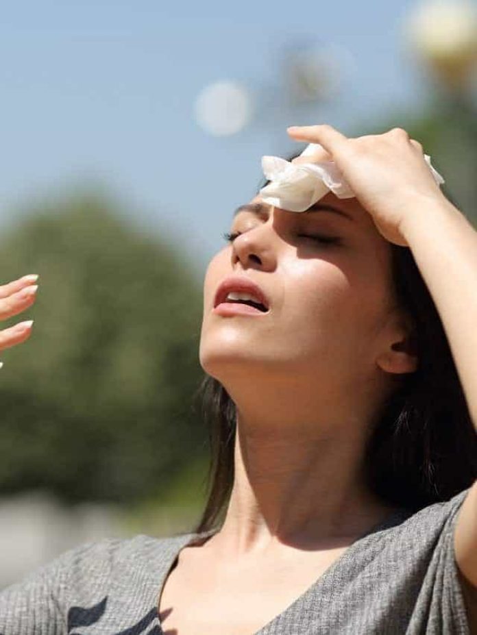 Stressed,Asian,Woman,Drying,Sweat,With,A,Cloth,In,A