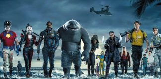 imagem mostra os principais personagens que contemplam o elenco do filme ESQUADRÃO SUICIDA. Todos eles estão numa praia, saindo de dentro do mar para a areia