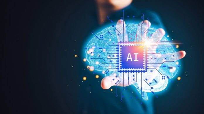 Um homem segura na mão uma holografia de um cérebro com um chip de inteligência artificial