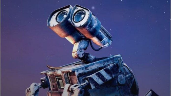 A imagem mostra o robô Wall-E, conhecido do filme da Pixar, com olhos grandes e redondos, que lembram binóculos. Ele tem uma aparência desgastada e está olhando para cima. O fundo é um céu estrelado, criando um clima de curiosidade e aventura. O robô é querido por sua missão de limpar a Terra e explorar o mundo ao seu redor.